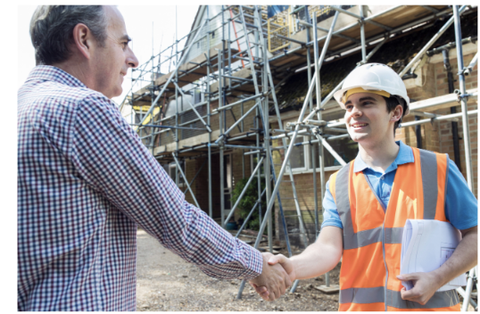 Builder handshake at a construction site