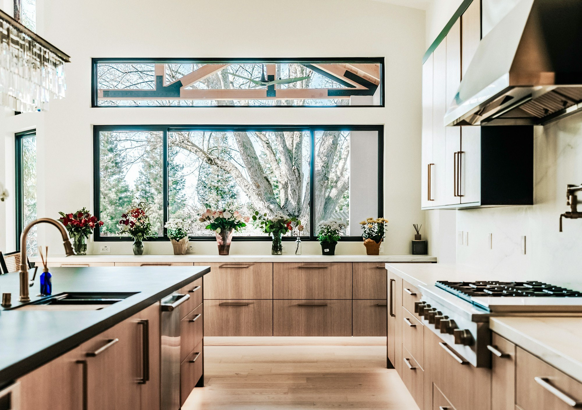 Finished kitchen renovation with timber cabinets and garden views